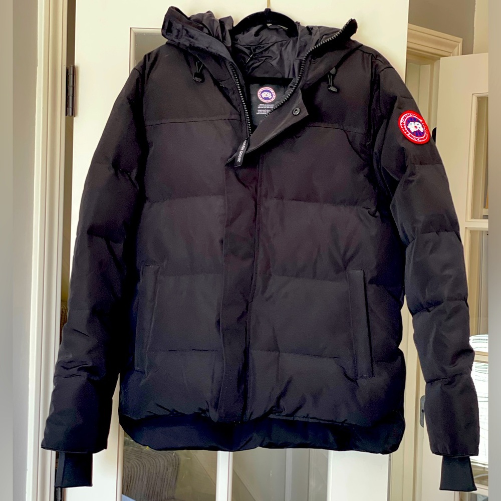 Heavyweight Black Parka with hood, zipper and snaps.